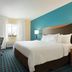 Fairfield Inn by Marriott Kankakee Bourbonnais guest room with king bed, desk, TV and window in Bourbonnais