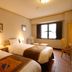 Hotel Monterey Nagasaki guest room in Nagasaki with two twin beds and window seating