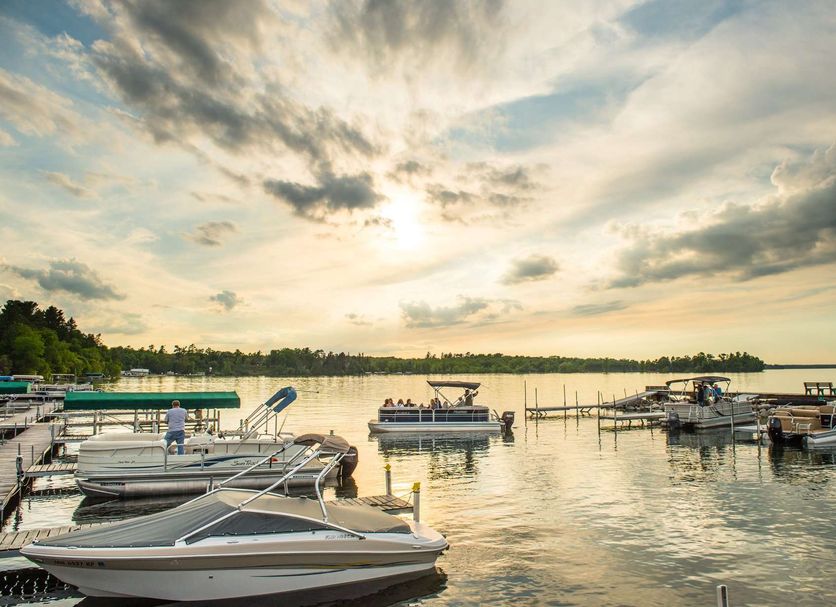 Chase On The Lake in Walker with lakeside docks and boats at sunset
