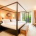 Hilton Frankfurt Gravenbruch in Neu Isenburg: canopy bed, sliding glass doors to balcony, and TV