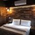 The Sarigerme Inn room in Sarigerme with rustic wood-paneled walls and a double bed
