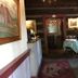 Spread Eagle Tavern and Inn in Hanoverton: historic inn hallway with framed art, leather chair and checkered table