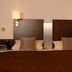 Garni-Hotel Adler in Ostfildern guest room with twin beds and wall lamps