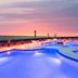 SpringHill Suites by Marriott Navarre Oceanfront rooftop pool at sunset overlooking the ocean