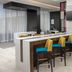 Crowne Plaza San Antonio Airport bar with yellow stools in modern lounge