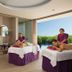 Breathless Riviera Cancun Resort & Spa spa treatment room with massage tables, soaking tub and lagoon view in Puerto Morelos