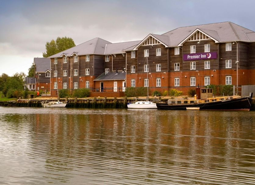 Premier Inn Isle Of Wight - Newport waterfront hotel with moored boats and river reflection in Newport