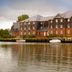 Premier Inn Isle Of Wight - Newport waterfront hotel with moored boats and river reflection in Newport