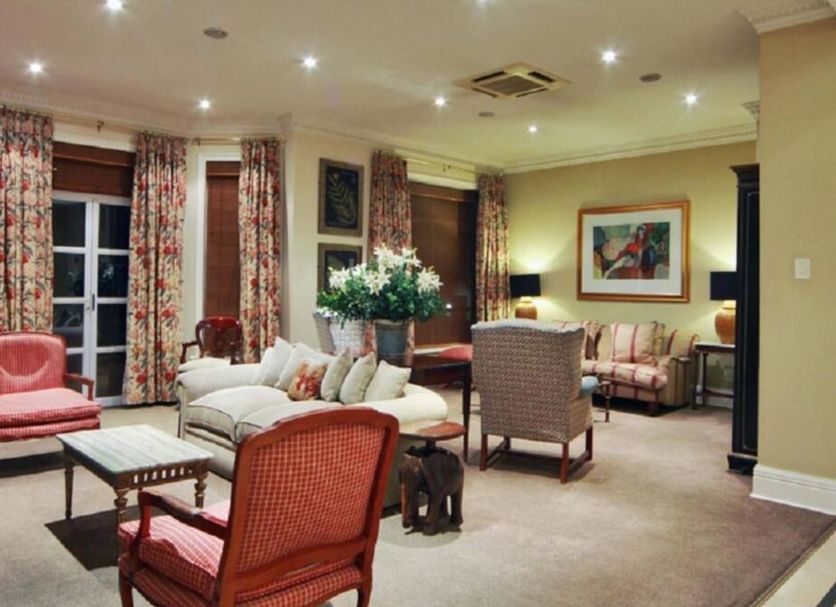 Redlands Hotel in Pietermaritzburg lounge with sofas, armchairs, coffee tables and floral decor