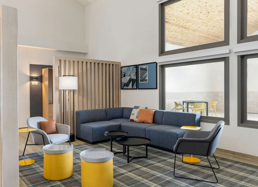 City Express by Marriott Bemidji lobby lounge with sectional seating and tall windows