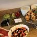 La Petite Apartments & Rooms, Gdansk breakfast spread with muffins, fruit, yogurt, and cereal