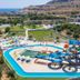 Olive Garden Hotel in Lardos with water slides, a pool, and sea and hillside views