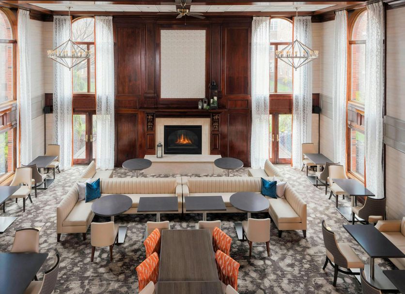 Residence Inn by Marriott West Orange lobby lounge with fireplace, tall windows, and seating area