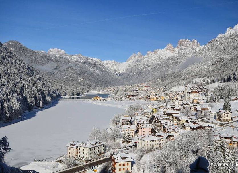Hotel Centrale in Auronzo di Cadore with snowy village and frozen lake mountain view