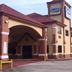Scottish Inn & Suites Hobby Airport in Houston, exterior entrance and parking area
