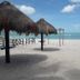 Hotel San Julio in Celestún: white-sand beach with thatched palapas and turquoise sea