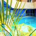 Golden Key Hotel, Accra indoor pool with blue water and surrounding lounge area