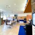 Toyoko Inn Izumo-shi Ekimae lobby with seating, glass entrance, and check-in counter in Izumo