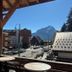 Le Cairn in Les Deux-Alpes with balcony view of village street and alpine mountains