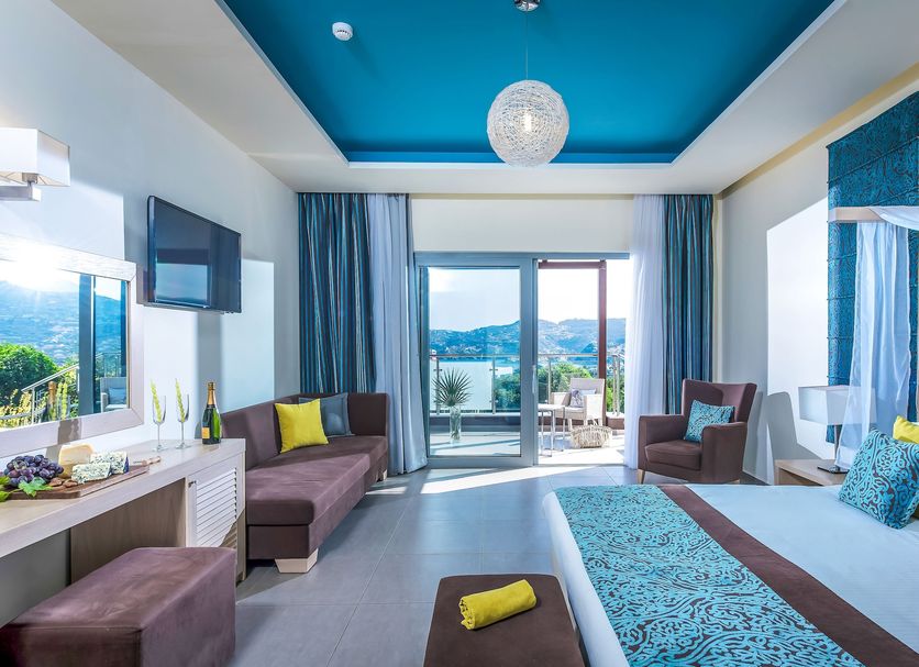 Blue Bay Resort Hotel in Agia Pelagia room with balcony sea view and blue ceiling