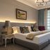 The Winchester Hotel by Newmark Cape Town bedroom with king bed and sitting area