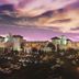 Fiesta Rancho Hotel And Casino in Las Vegas exterior at dusk with casino sign and parking lot