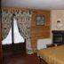 Residence Ruetoreif room in Gressoney-Saint-Jean with rustic wood walls, fireplace and double bed