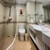 Linyi Hotel (Yimeng Road Branch) bathroom with shower, toilet, sink and large mirror in Linyi