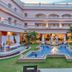 Club Mahindra Emerald Palms, Goa in Varca: courtyard pool with fountain and white arches