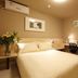 Century Star Urumqi Changjiang Road Hotel guest room with double bed, desk, chair and wall art