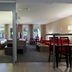 Residence La Reserve, Ferney-Voltaire suite with bedroom, dining area and balcony view