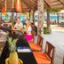 Hotel Villa Taina bar with pineapple centerpiece and oceanfront beach views in Sosúa