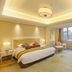 Dongjiao State Guesthouse Nanjing guest room with king bed, seating area, and large window