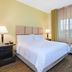 Candlewood Suites Morgantown-Univ West Virginia guest room with bed, TV, and window with curtains