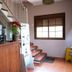 Hostal Rural La Plata Parking Incluido lobby with staircase and wooden reception desk in Arcos de la Frontera