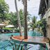 Seashell Resort Hostel Koh Tao pool with tropical landscaping and palm trees in Ko Tao
