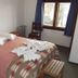 Hosteria Las Amapolas room in San Carlos de Bariloche with double bed and window view
