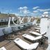 Rooftop terrace at Hospes Las Casas del Rey de Baeza, Seville, with lounge chairs and pool view