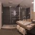 Hotel Chateau Gbelany bathroom with walk-in shower, sink vanity, and mirror in Gbelany