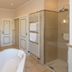 Romantik Parkhotel Wasserburg Anholt bathroom in Isselburg with double sinks, bathtub and glass shower