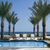 JW Marriott St. Maarten Beach Resort & Spa pool with palm trees and ocean view in Upper Prince's Quarter