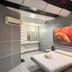 Astrotel Cubao in Quezon City shows a space-themed room with a double bed and sci-fi wall art