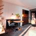 Zenitude Hotel Residences - Grenoble Alpexpo room with sofa, dining area and kitchenette in Grenoble