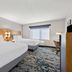 Baton Rouge Inn & Suites LSU-Medical Corridor room with two double beds and a window in Baton Rouge