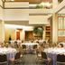 Sheraton Atlanta Airport Hotel in Atlanta ballroom with round banquet tables and chairs under skylit atrium