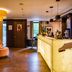 Hotel & Spa Savarin in Rijswijk lobby with amber chandelier, marble reception desk and lounge seating