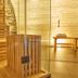 Burgblick in Bernkastel-Kues sauna interior with wood slats, glass walls and towel bench