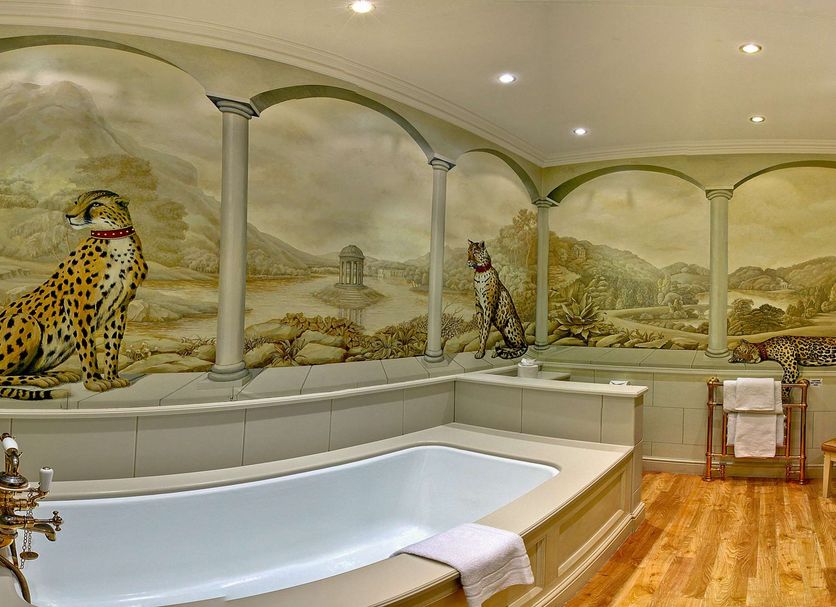 The Welcombe Hotel, Stratford-upon-Avon: bathroom with a freestanding tub and safari mural wall art