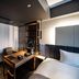 Grids Premium Hotel Osaka Namba room with desk, bed, and compact workout equipment in Osaka
