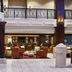 Four Points by Sheraton Little Rock Midtown lobby with bar seating and mezzanine railing